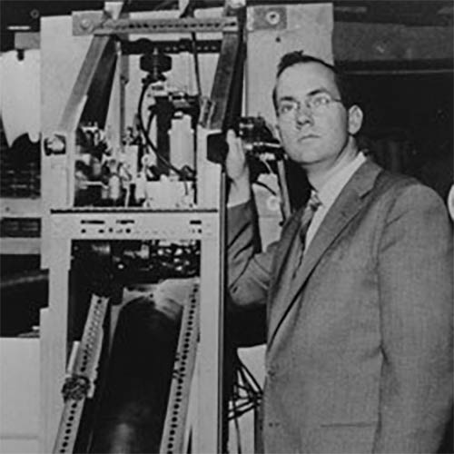 Charles Townes standing with the second ammonia beam MASER at Columbia University, 1955. Photo courtesy of the AIP Emilio Segrè Visual Archives, Physics Today Collection